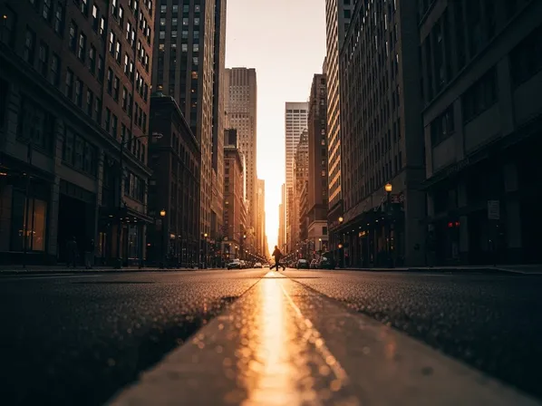 camera placed near the road with wide perspective and strong converging leading lines toward a clear vanishing point for cinematic depth and scale.