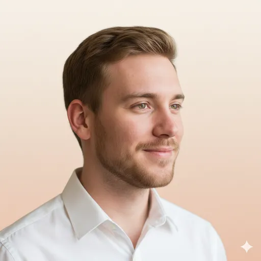 A warm peach-to-cream gradient headshot with a white shirt—soft, friendly, and polished for professional profiles.